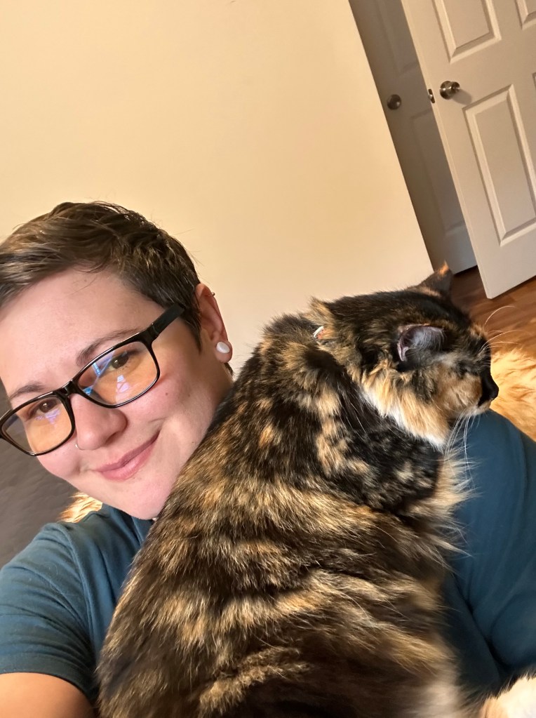 Kristina holding her cat Nyx